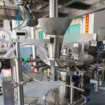 Filling station â Z-type elevator feeding product through the funnel into the pouch